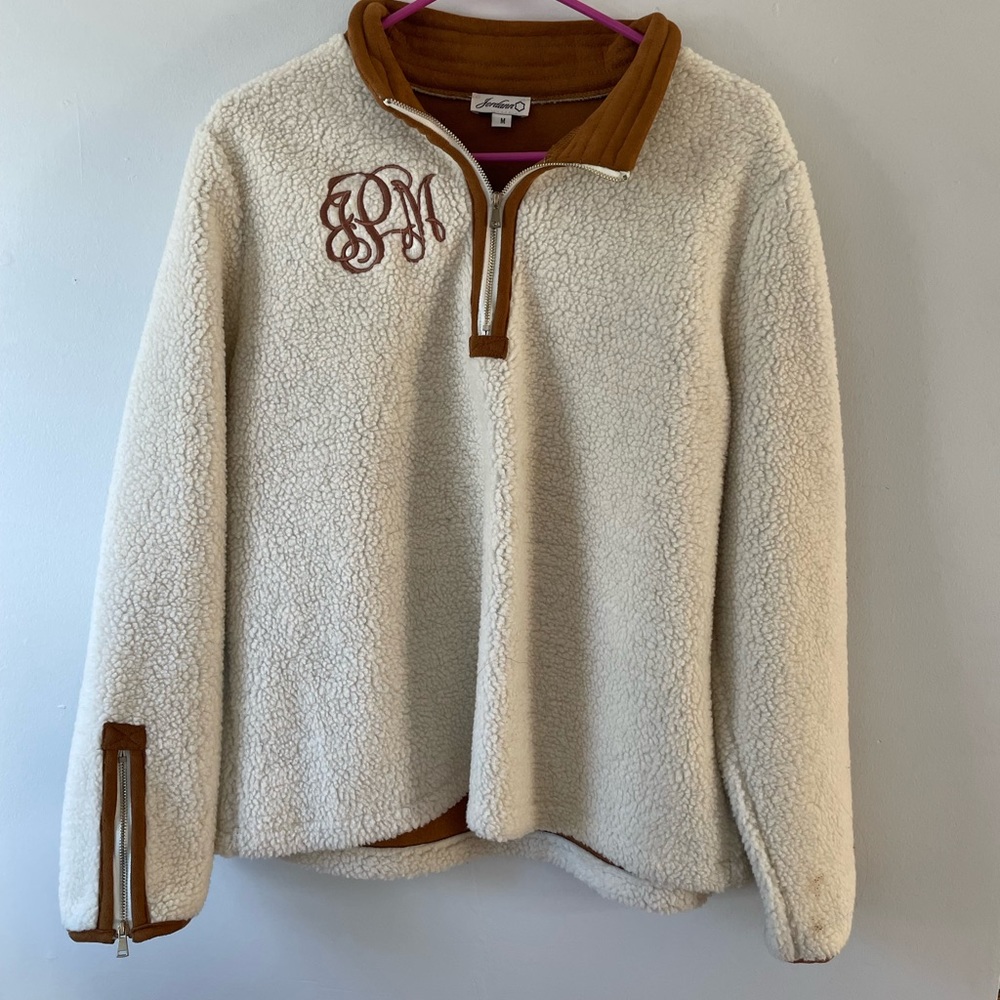 Cream and brown fitted half zip coat with monogram JMP!